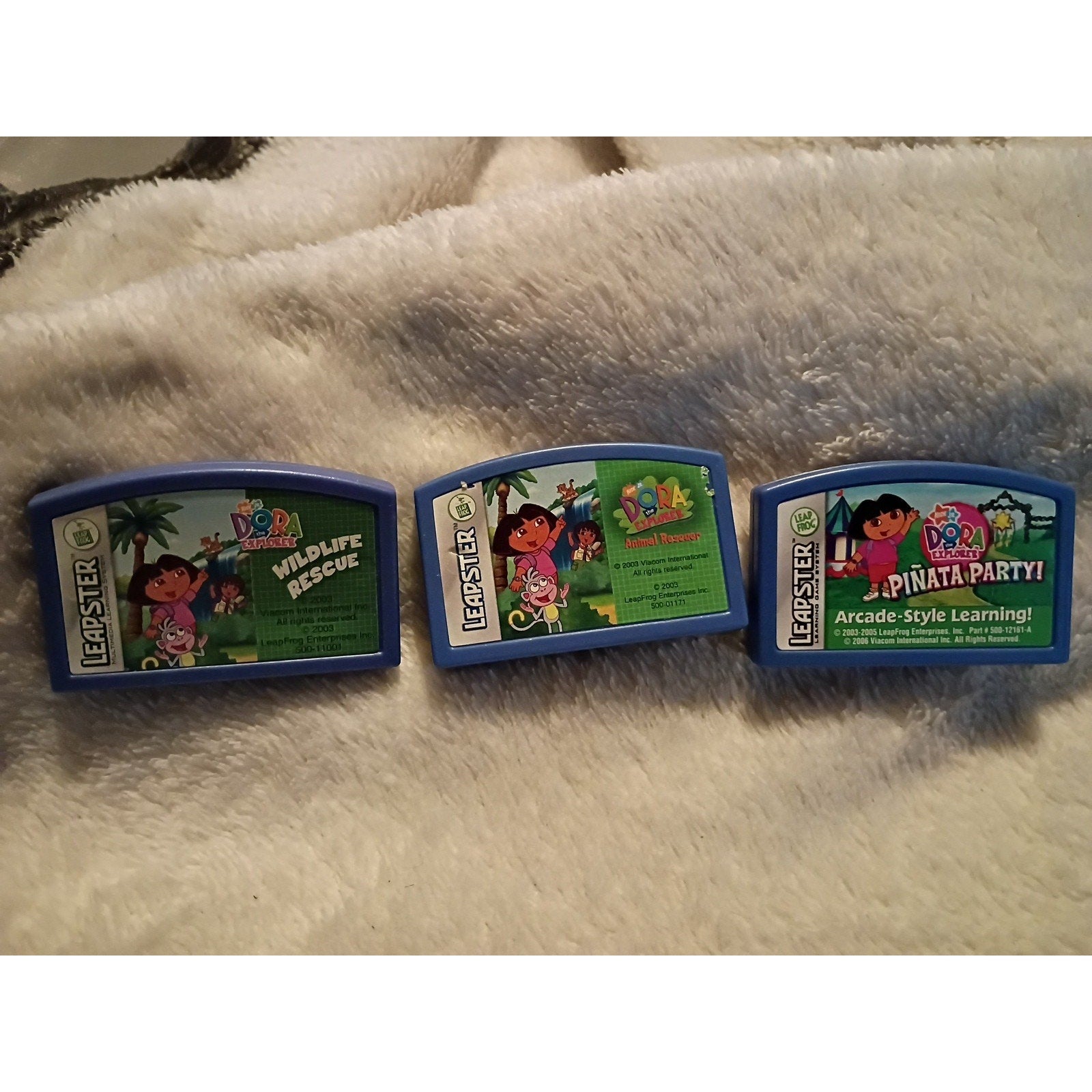 Leapster games DORA the EXPLORER PINATA PARTY & WILDLIFE RESCUE & Animal Rescue